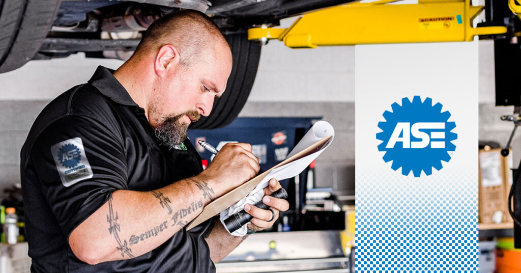 Pearson's ASE-certified mechanic examines a car at the auto shop in Alaska