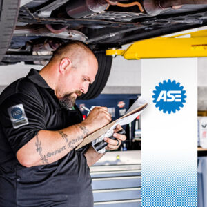 Pearson's ASE-certified mechanic examines a car at the auto shop in Alaska