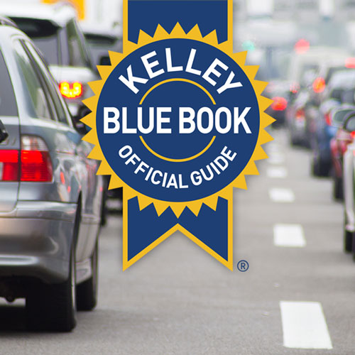 Two lanes of traffic, featuring the Kelley Blue Book label